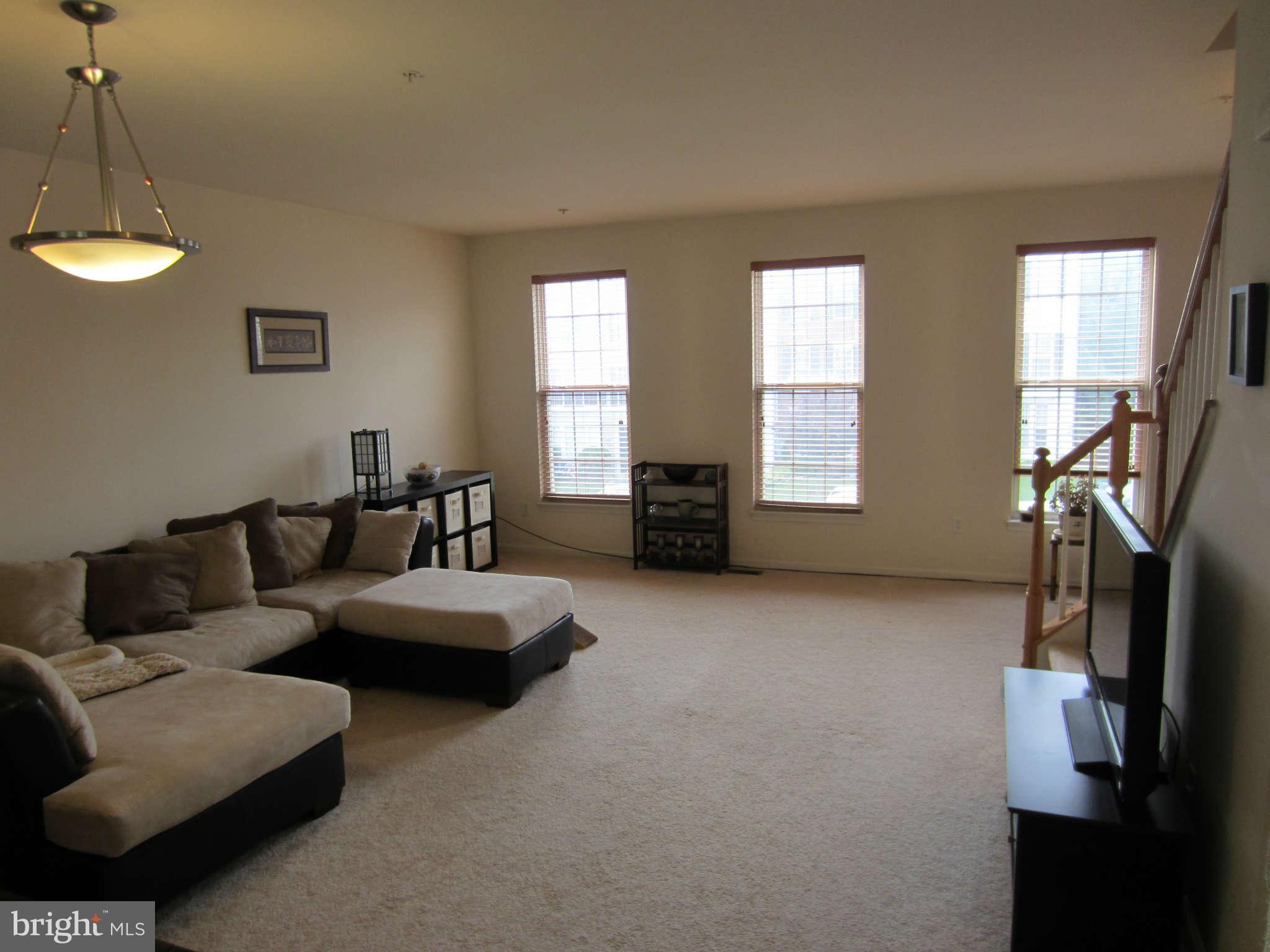 512 Ellison Court Frederick, MD 21703 - Photo 9 of 30 a living room with furniture and a window