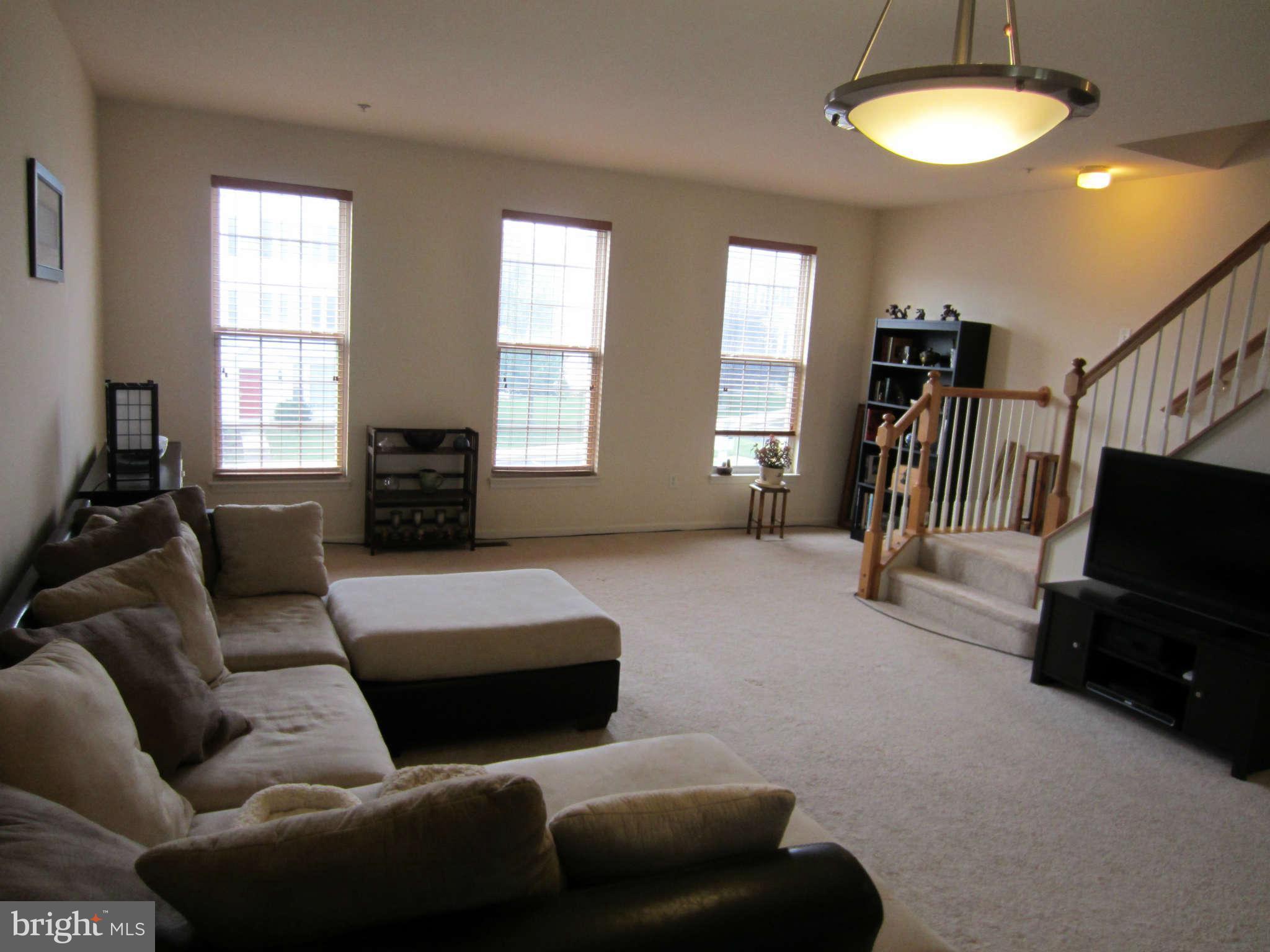 512 Ellison Court Frederick, MD 21703 - Photo 10 of 30 a living room with furniture and a flat screen tv