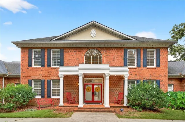 an aerial view of a house with a lake view