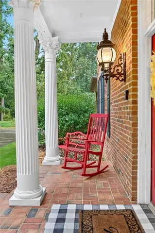a living room with furniture fireplace and flat screen tv