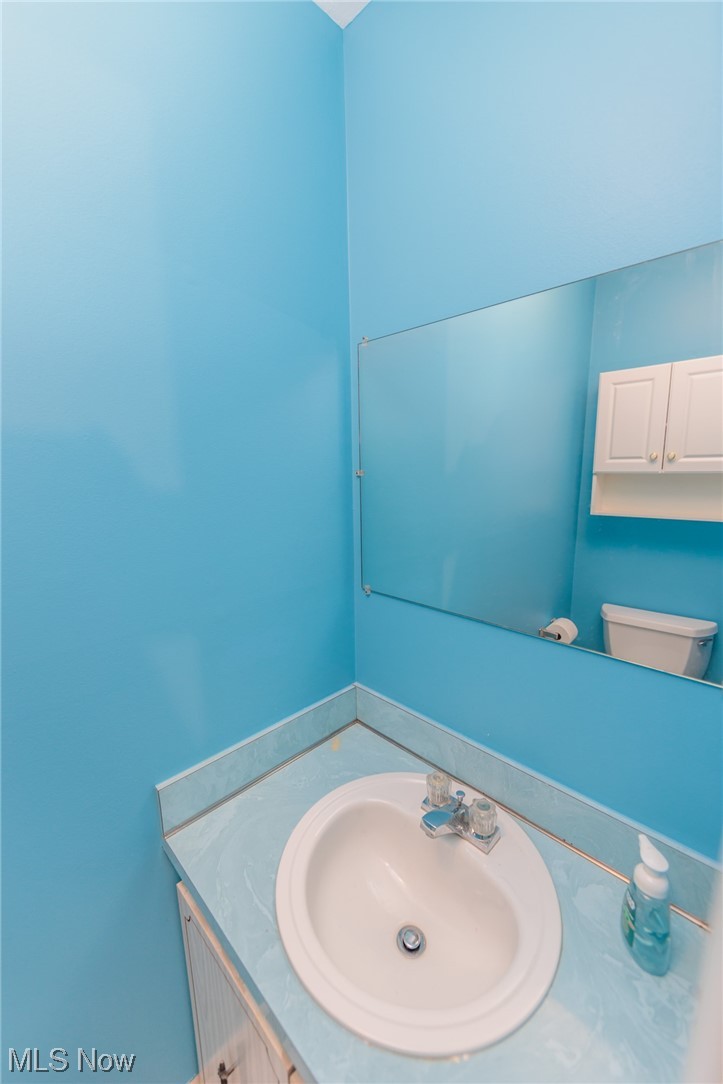 6472 State Road, Unit J19 Parma, OH 44134 - Photo 25 of 33 Bathroom with toilet and vanity with extensive cabinet space