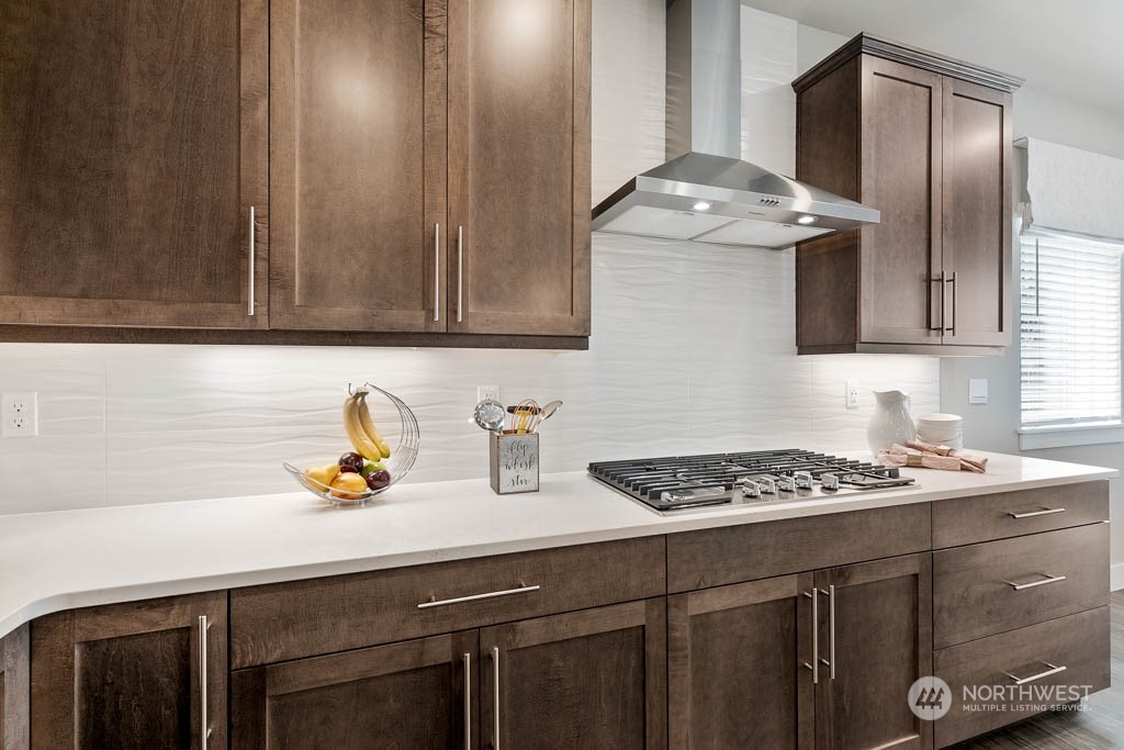 22917 20th Place West Bothell, WA 98021 - Photo 14 of 32 a kitchen with a sink cabinets and stainless steel appliances