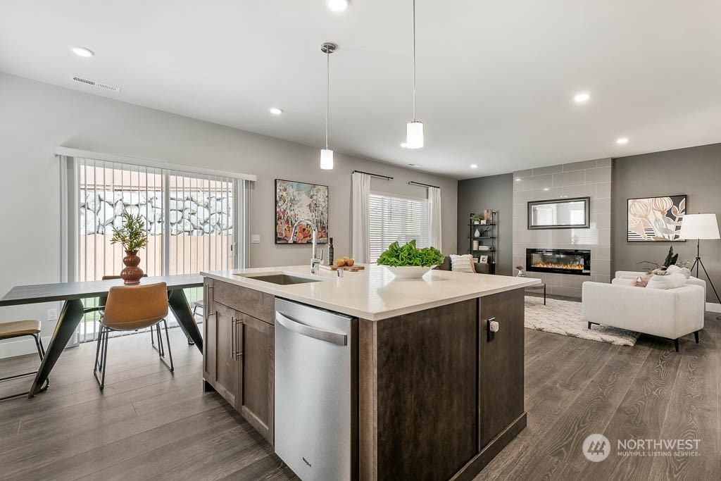 22917 20th Place West Bothell, WA 98021 - Photo 17 of 32 a kitchen with center island and living room