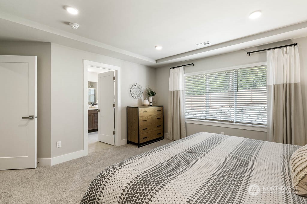 22917 20th Place West Bothell, WA 98021 - Photo 22 of 32 a bedroom with a bed and a large window
