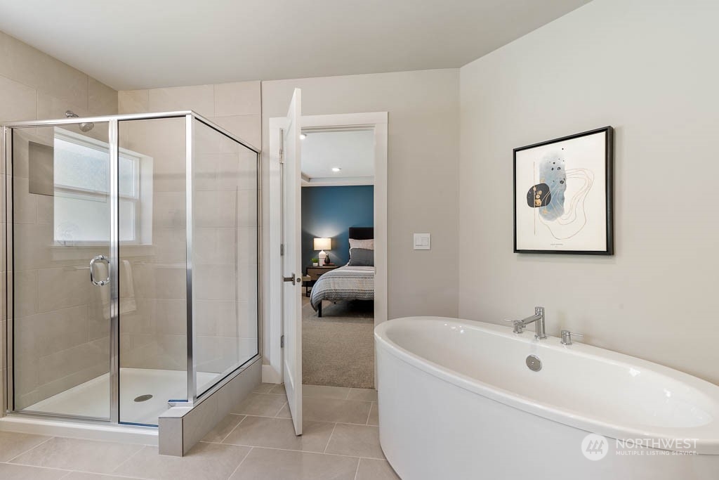 22917 20th Place West Bothell, WA 98021 - Photo 25 of 32 a bathroom with a bathtub and a shower