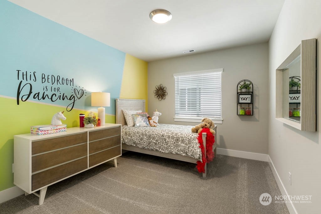 22917 20th Place West Bothell, WA 98021 - Photo 29 of 32 a room with a bed and a desk