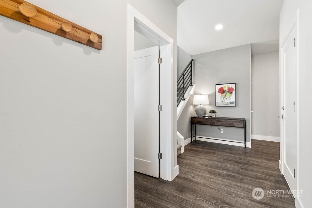 22917 20th Place West Bothell, WA 98021 - Photo 3 of 32 a view of a hallway view with wooden floor and staircase