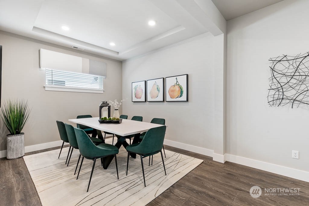 22917 20th Place West Bothell, WA 98021 - Photo 8 of 32 a view of a dining room with furniture and wooden floor