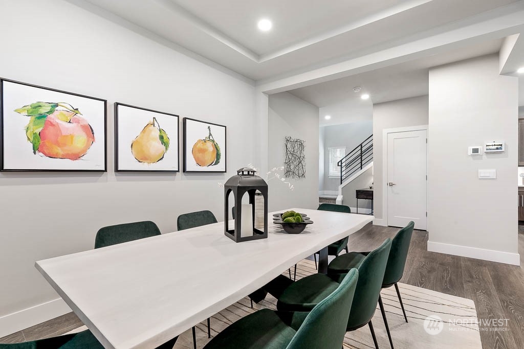22917 20th Place West Bothell, WA 98021 - Photo 9 of 32 a dining room with furniture and painting on the wall
