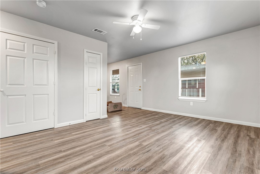 802-804 Navidad Street Bryan, TX 77801 - Photo 11 of 48 a view of an empty room with wooden floor and a window