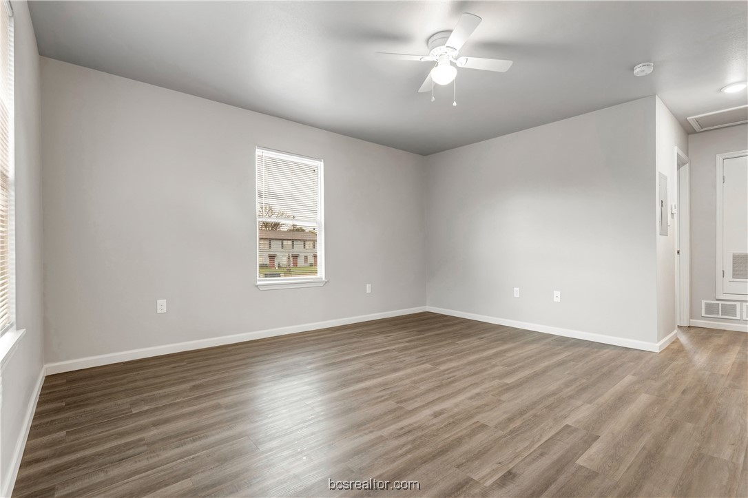 802-804 Navidad Street Bryan, TX 77801 - Photo 12 of 48 wooden floor in an empty room with a window