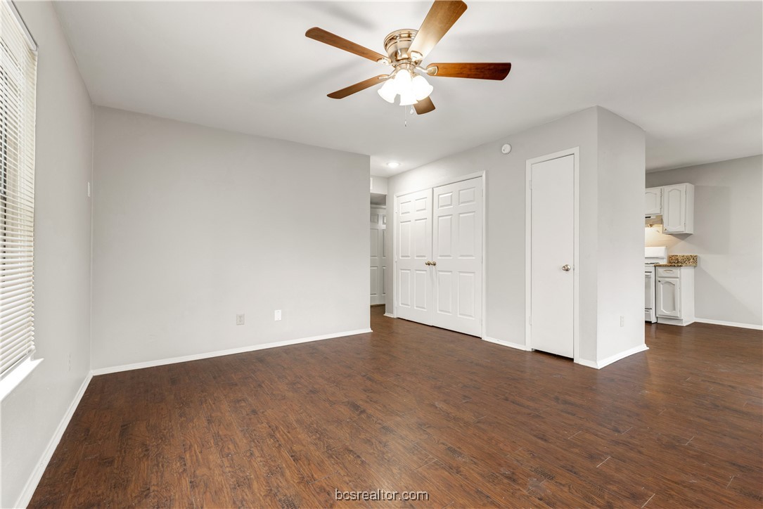 802-804 Navidad Street Bryan, TX 77801 - Photo 15 of 48 an empty room with wooden floor and a ceiling fan