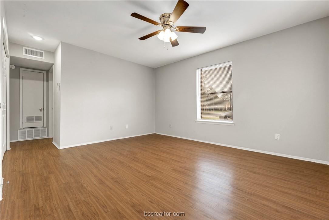 802-804 Navidad Street Bryan, TX 77801 - Photo 33 of 48 an empty room with wooden floor and windows