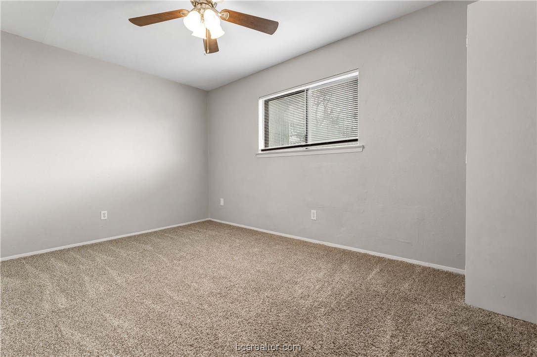 802-804 Navidad Street Bryan, TX 77801 - Photo 34 of 48 an empty room with a chandelier fan