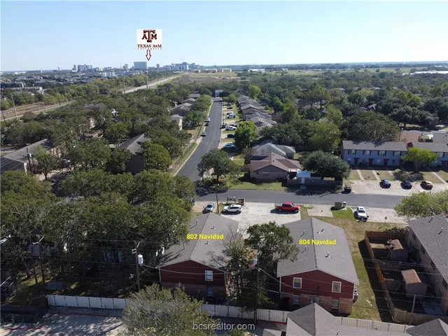 an aerial view of a town with couple of houses