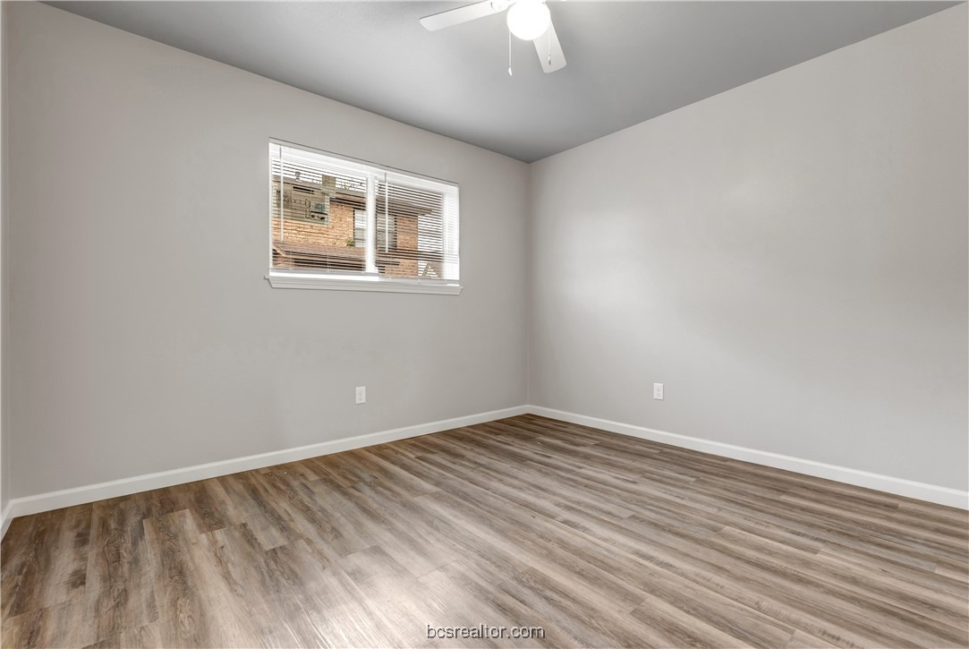 802-804 Navidad Street Bryan, TX 77801 - Photo 41 of 48 a view of an empty room with wooden floor and a window