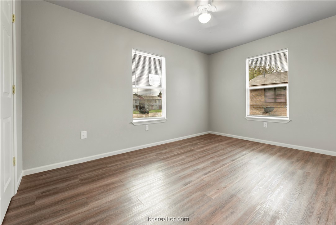 802-804 Navidad Street Bryan, TX 77801 - Photo 43 of 48 an empty room with wooden floor and windows