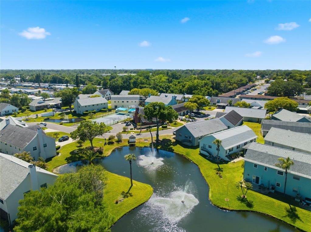 6129 Elmhurst Drive New Port Richey, FL 34653 - Photo 17 of 34 an aerial view of a house with a swimming pool