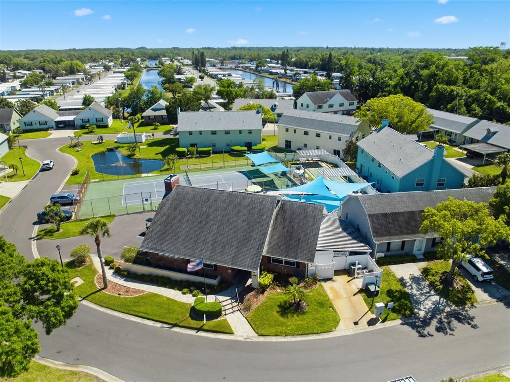 6129 Elmhurst Drive New Port Richey, FL 34653 - Photo 18 of 34 an aerial view of residential houses with outdoor space and parking
