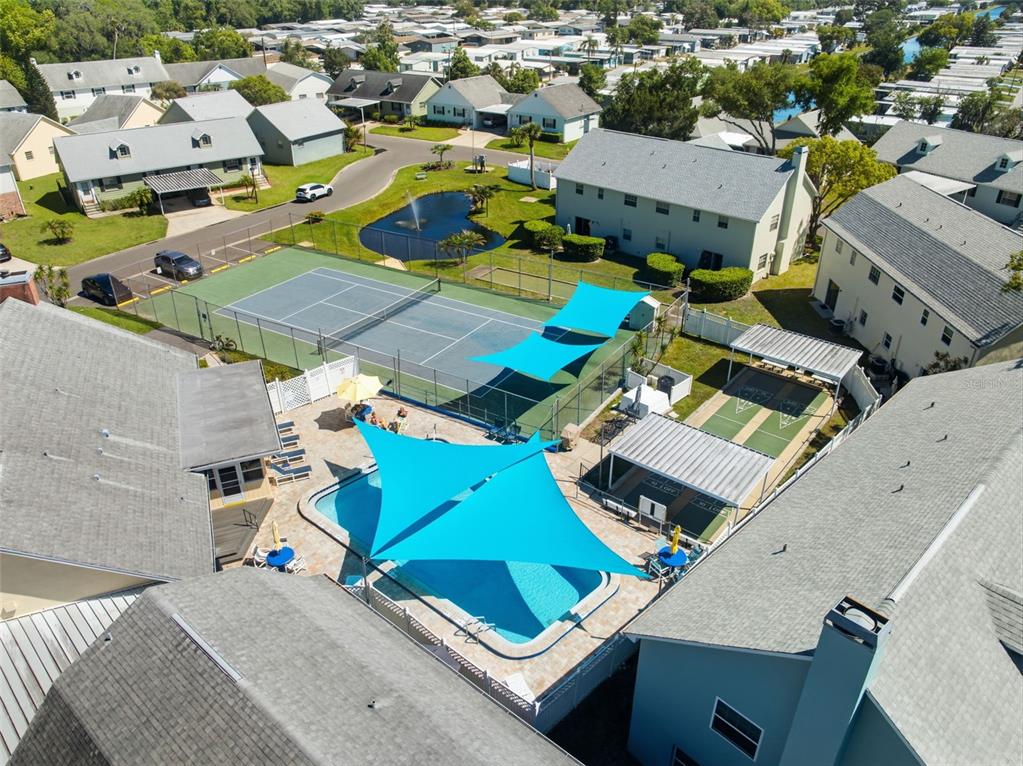 6129 Elmhurst Drive New Port Richey, FL 34653 - Photo 19 of 34 an aerial view of residential houses with outdoor space