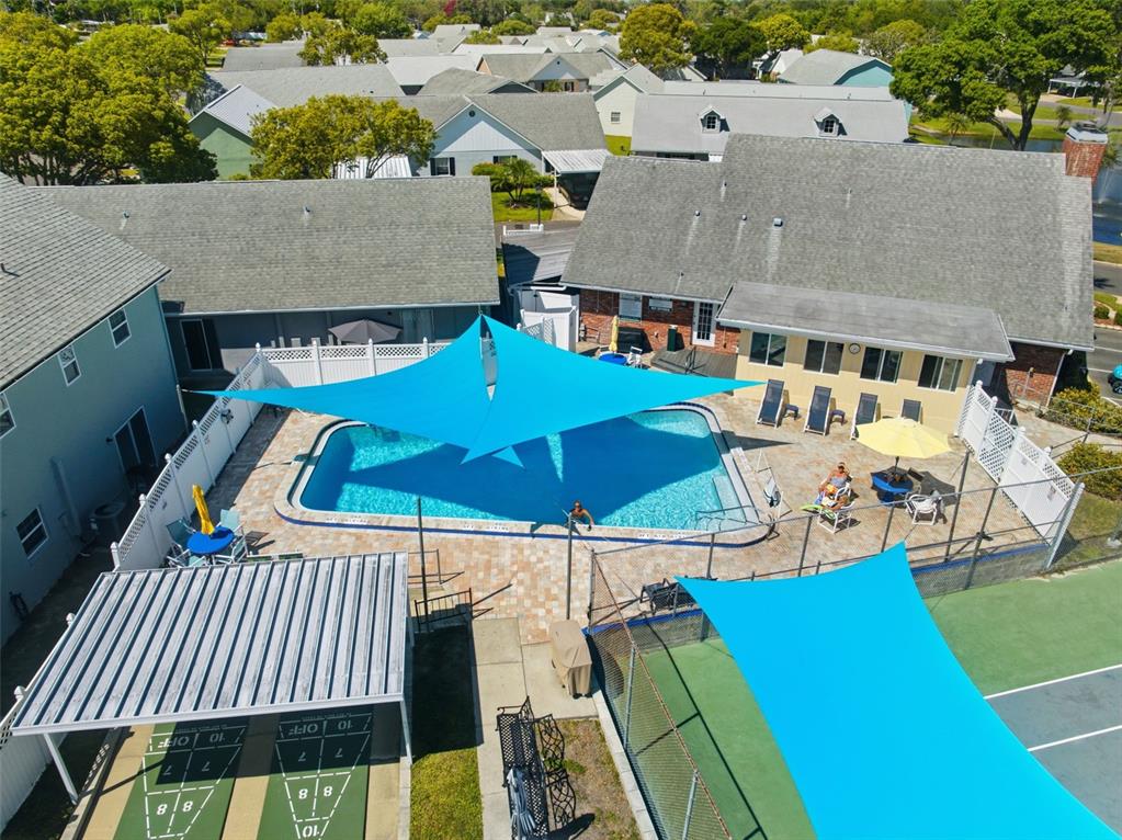 6129 Elmhurst Drive New Port Richey, FL 34653 - Photo 22 of 34 an aerial view of a house with swimming pool and patio