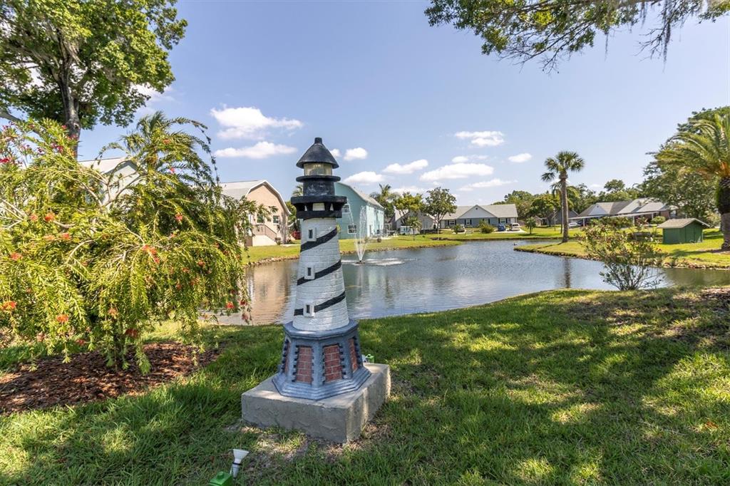 6129 Elmhurst Drive New Port Richey, FL 34653 - Photo 32 of 34 a view of a lake with houses