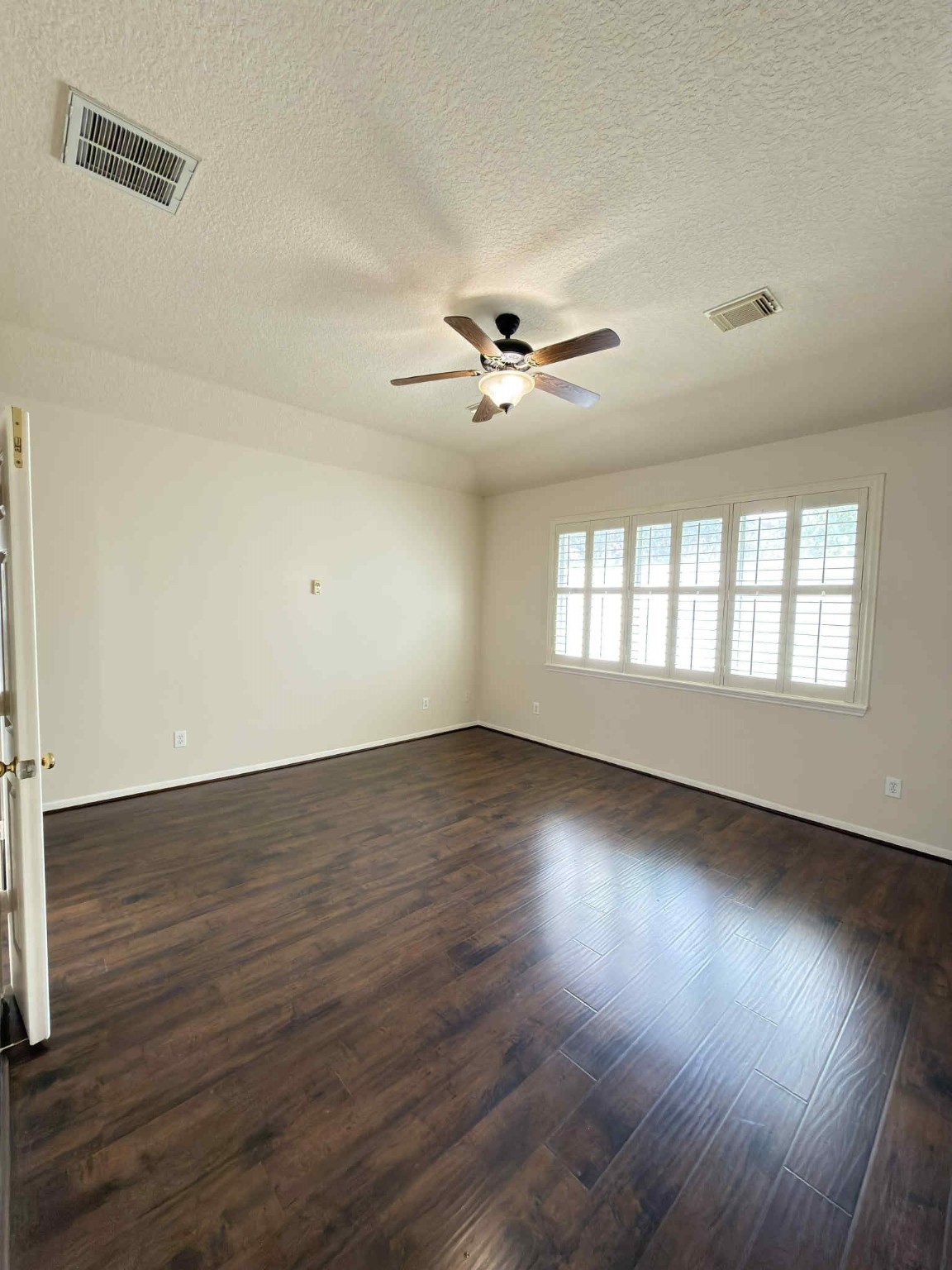 9531 Summer Run Houston, TX 77064 - Photo 12 of 29 an empty room with wooden floor and windows