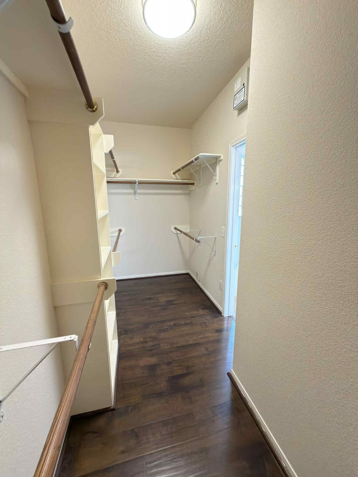 9531 Summer Run Houston, TX 77064 - Photo 17 of 29 a view of walk in closet with wooden floor