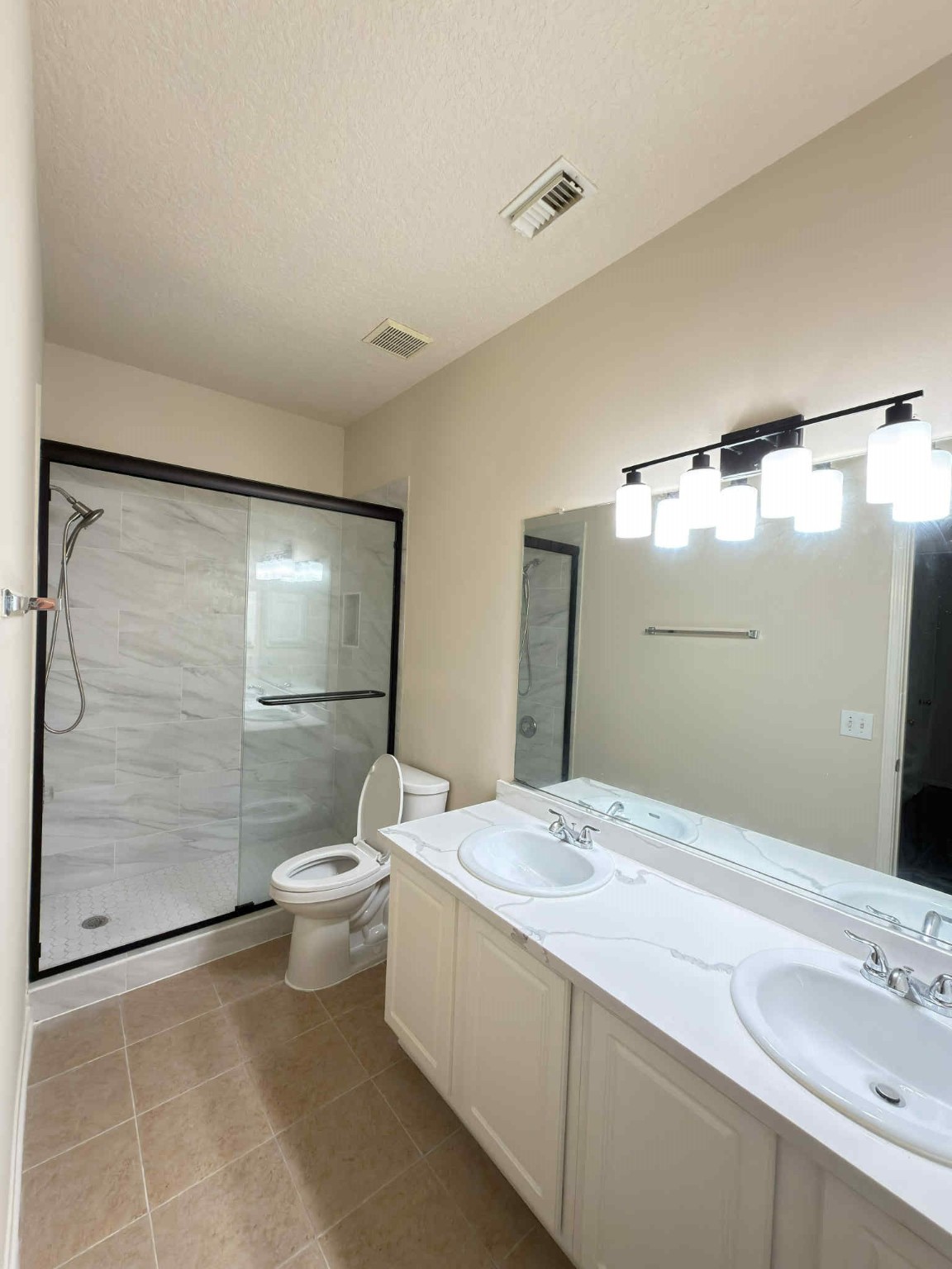 9531 Summer Run Houston, TX 77064 - Photo 20 of 29 a bathroom with a double vanity sink toilet and shower