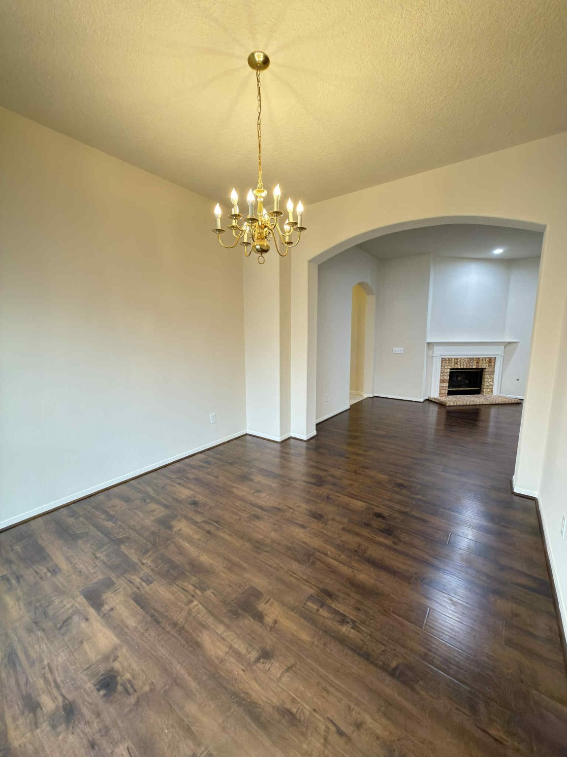 9531 Summer Run Houston, TX 77064 - Photo 9 of 29 a view of empty room with wooden floor and kitchen