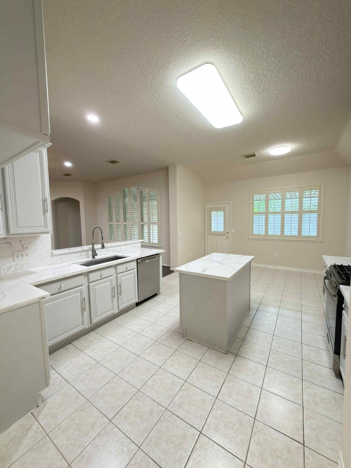 9531 Summer Run Houston, TX 77064 - Photo 10 of 29 a large white kitchen with a sink a counter top space and appliances