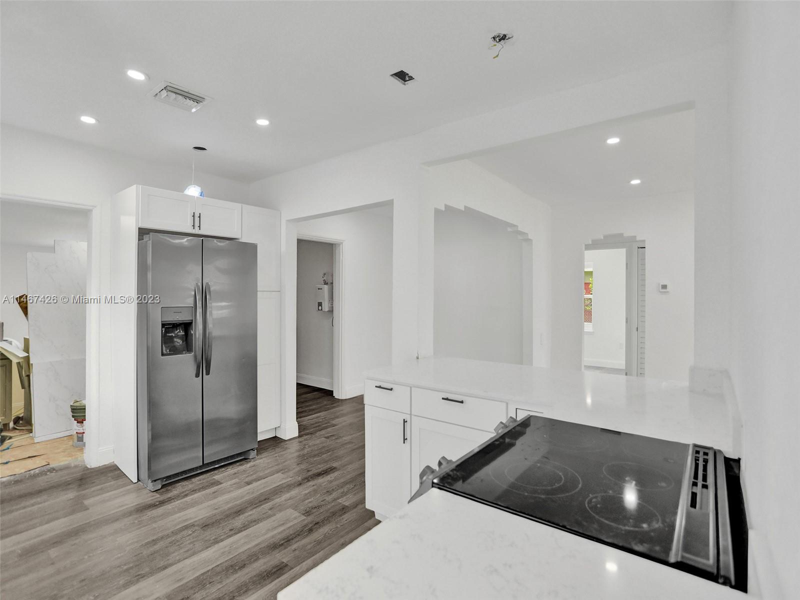 167 Northwest 84th Street Miami, FL 33150 - Photo 11 of 39 a kitchen with a sink and refrigerator