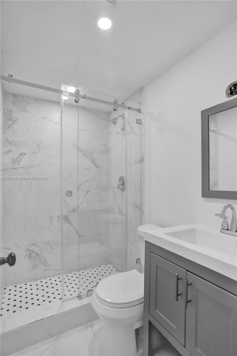 167 Northwest 84th Street Miami, FL 33150 - Photo 19 of 39 a bathroom with a sink a toilet and shower