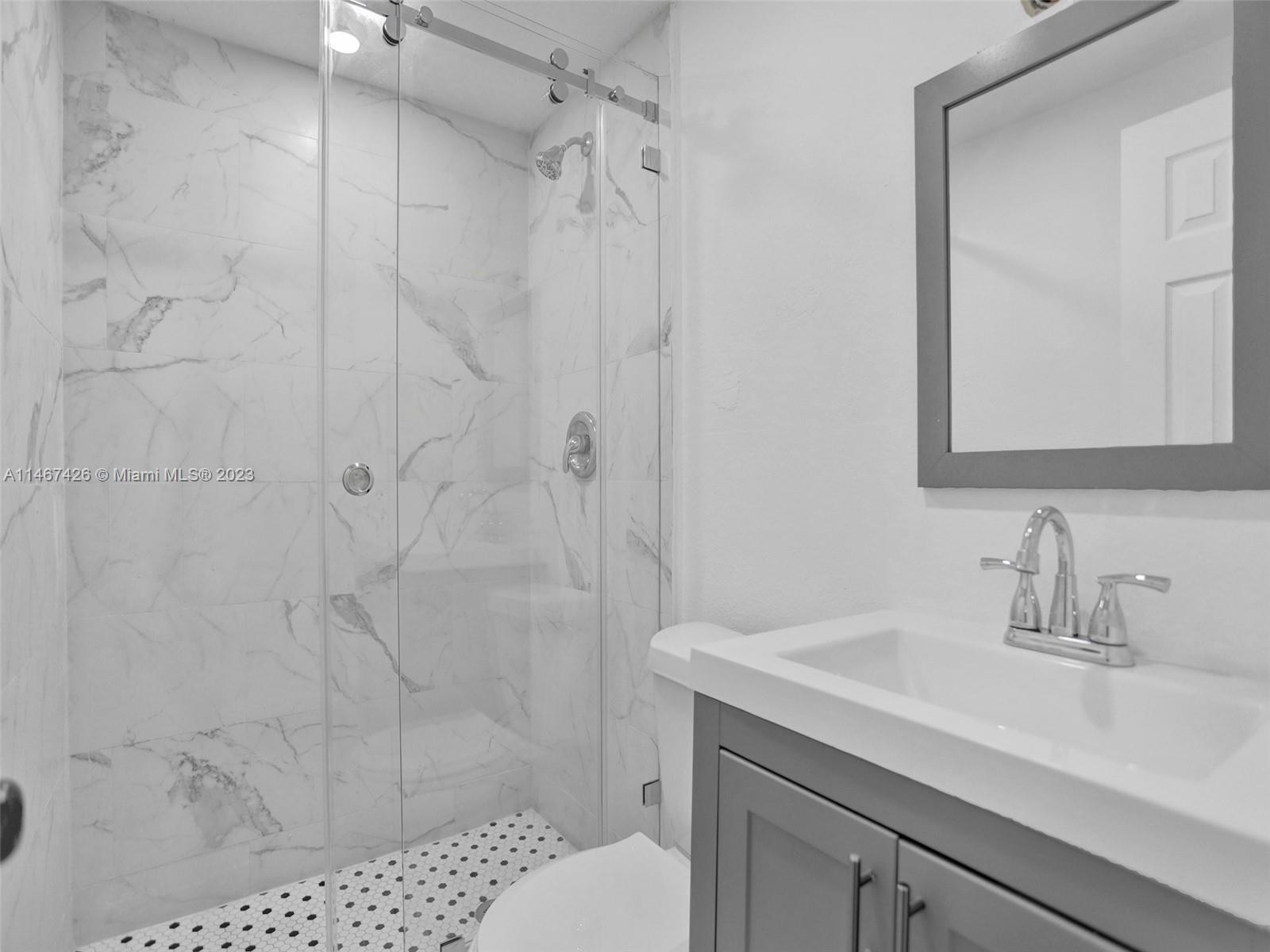 167 Northwest 84th Street Miami, FL 33150 - Photo 20 of 39 a bathroom with a sink a toilet and shower
