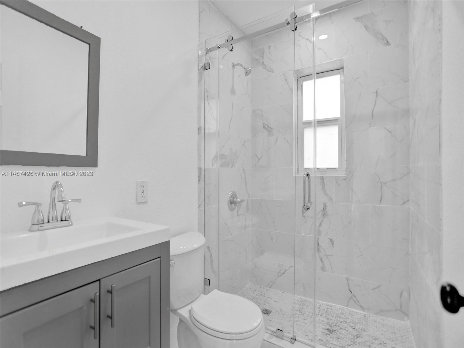 167 Northwest 84th Street Miami, FL 33150 - Photo 30 of 39 a bathroom with a sink a toilet and shower