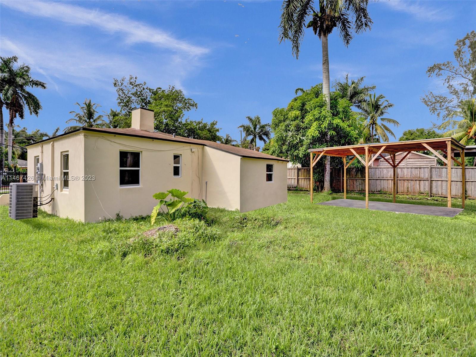 167 Northwest 84th Street Miami, FL 33150 - Photo 33 of 39 a house view with a garden space