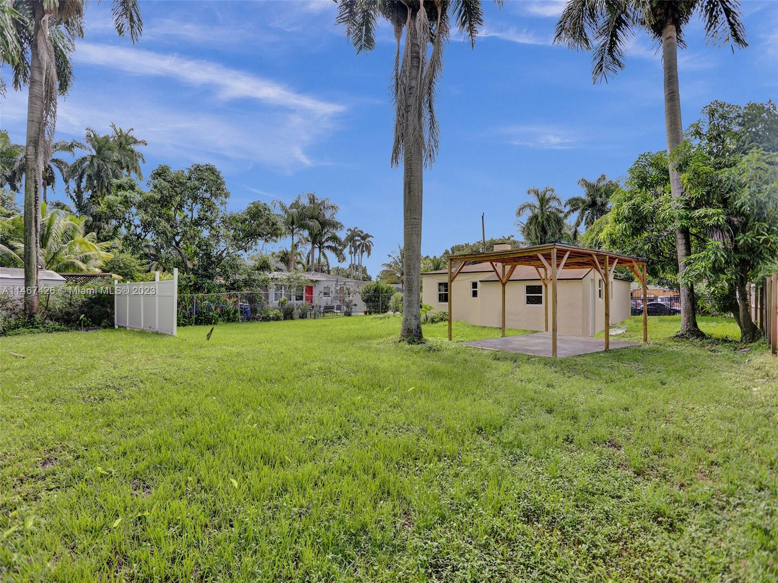 167 Northwest 84th Street Miami, FL 33150 - Photo 34 of 39 a house view with a garden space