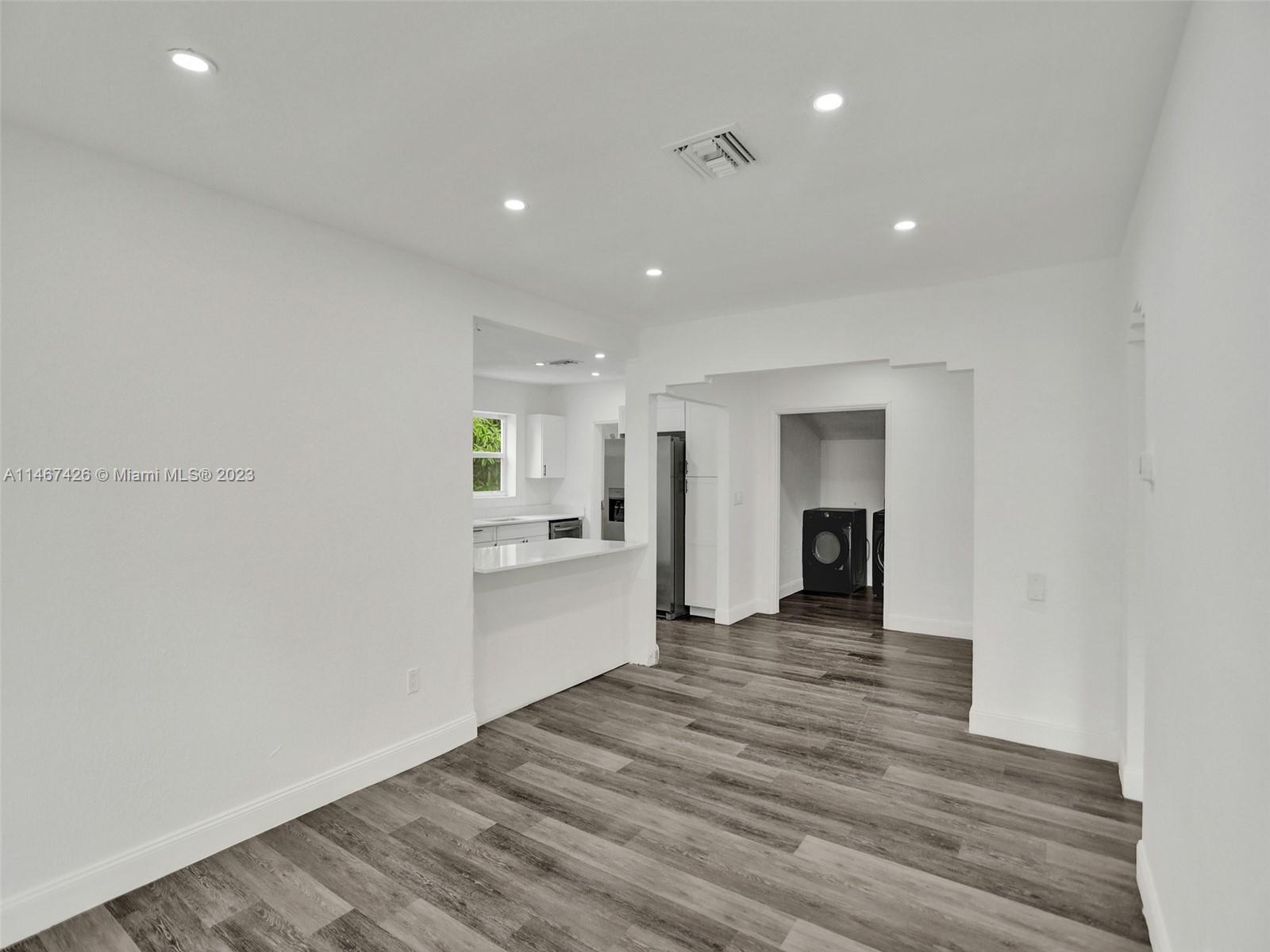 167 Northwest 84th Street Miami, FL 33150 - Photo 6 of 39 a view of a kitchen with a sink and a stove top oven
