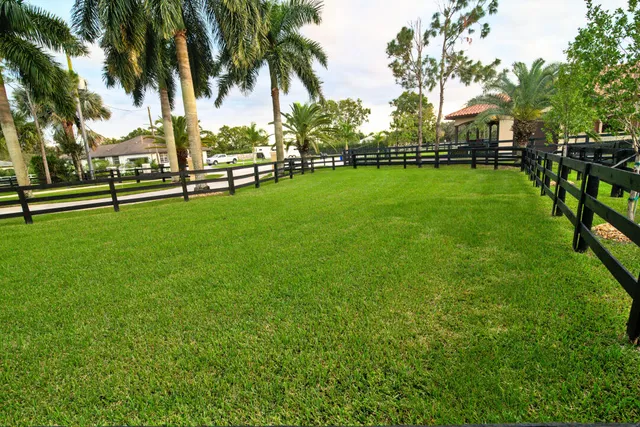 a kitchen with metallic refrigerator freezer and a dishwasher