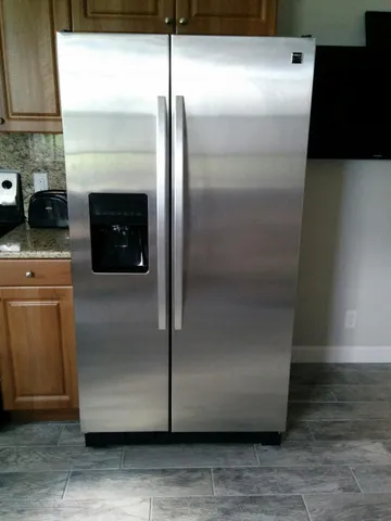 a bathroom with a granite countertop toilet sink and shower