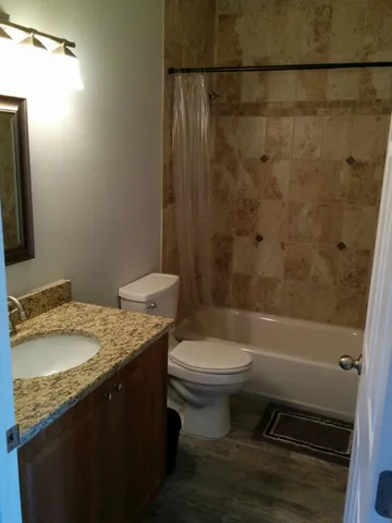 a kitchen with a sink a window and cabinets