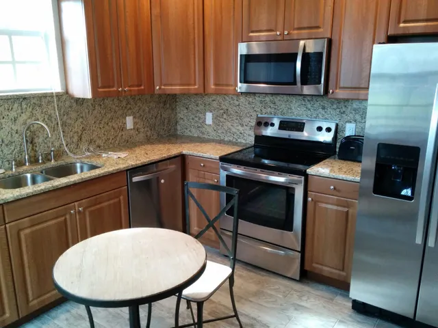 a kitchen with a stove and a microwave