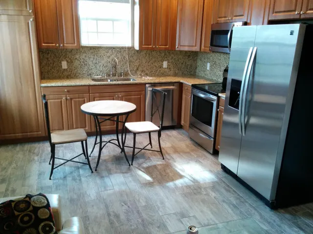 a view of a chairs and table in the kitchen