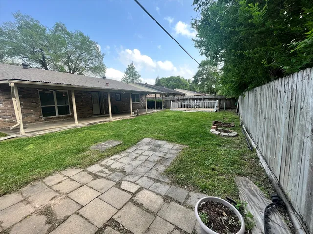 a backyard of a house with lots of green space