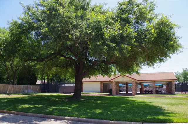 a front view of house with yard and outdoor seating