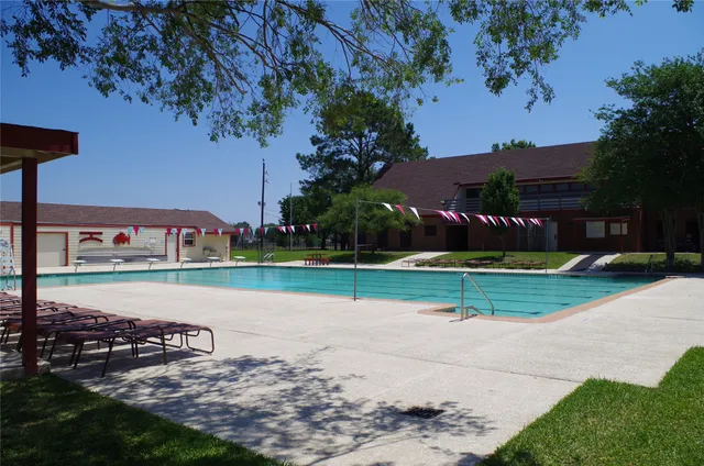 a view of a kitchen with stainless steel appliances granite countertop a sink and cabinets