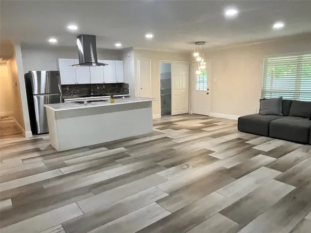 a view of empty room with window and fireplace