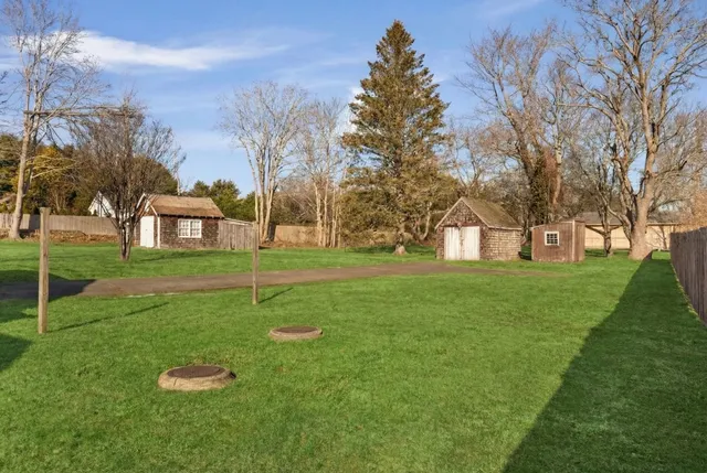 a view of a house with a backyard