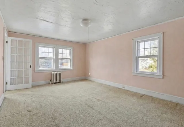 an empty room with windows