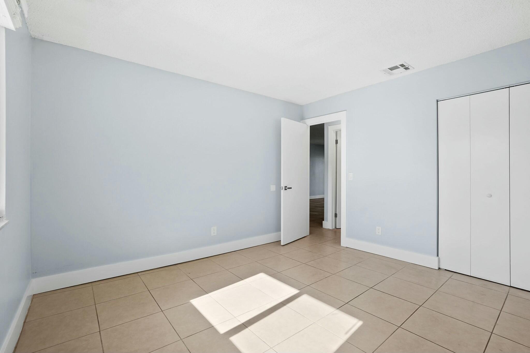983 Northwest Spruce Ridge Drive, Unit 4 Stuart, FL 34994 - Photo 20 of 56 a view of an empty room